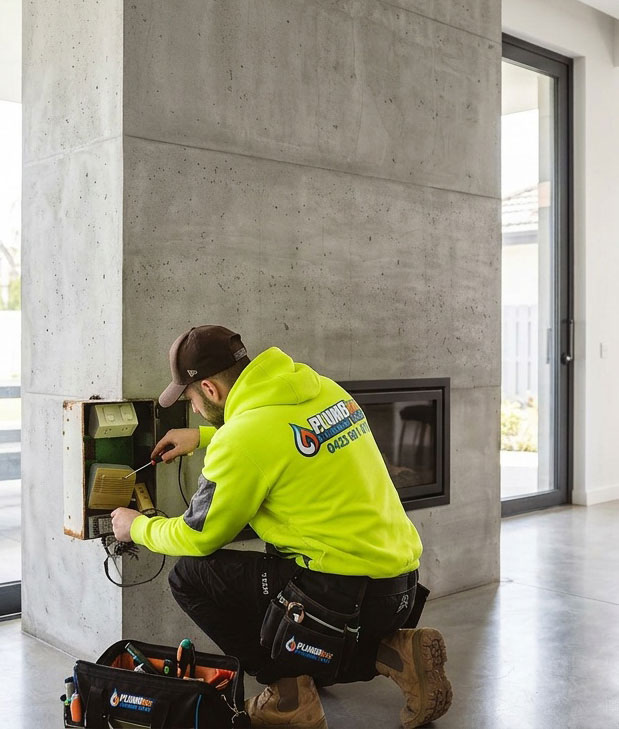 Dylan from PlumbInc servicing a domestic indoor wall mounted gas heater
